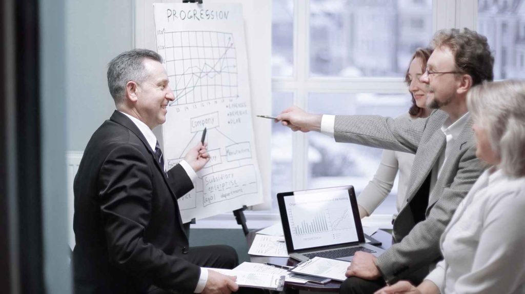 Apport de titres à une holding : report d'imposition et conditions